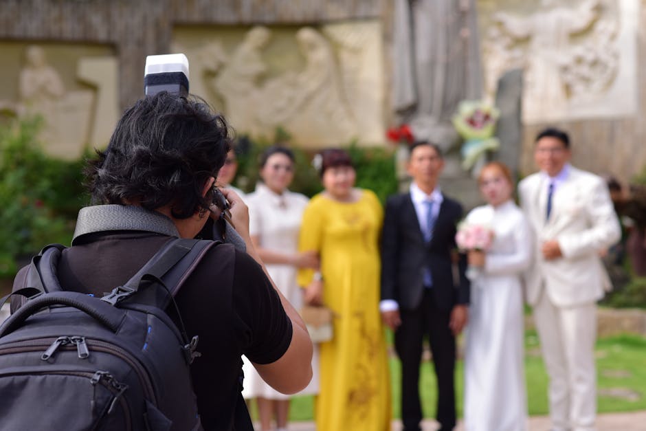 Professional wedding photographer at work during a ceremony